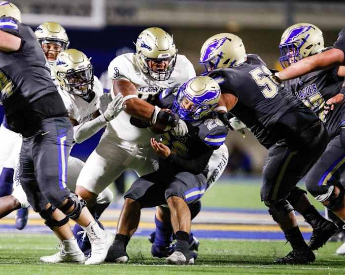 Malachi Finau makes a tackle while playing for St. John Bosco.
